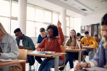 student raising hand